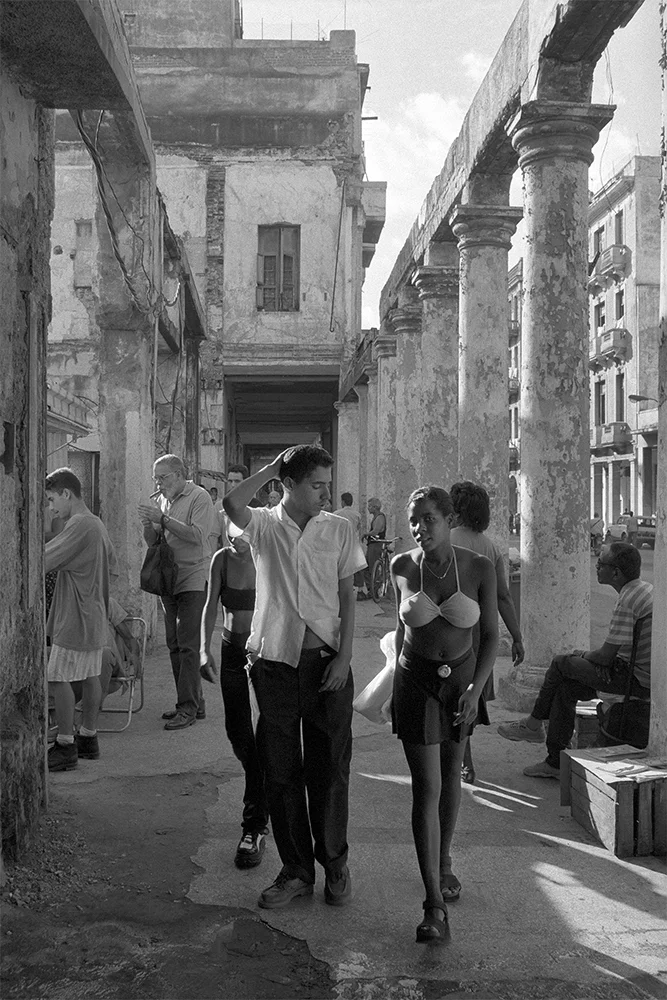 Boy Looking at Girl’s Halter , Havana, Cuba, 1999 Archival pigment print. 20 x 13 3/8 inches