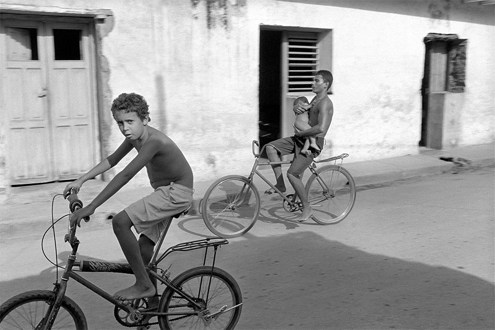   Boy on Bike with Baby , Trinidad, Cuba, 2000  Archival Inkjet Print  13 3/8 x 20" &nbsp;$800 