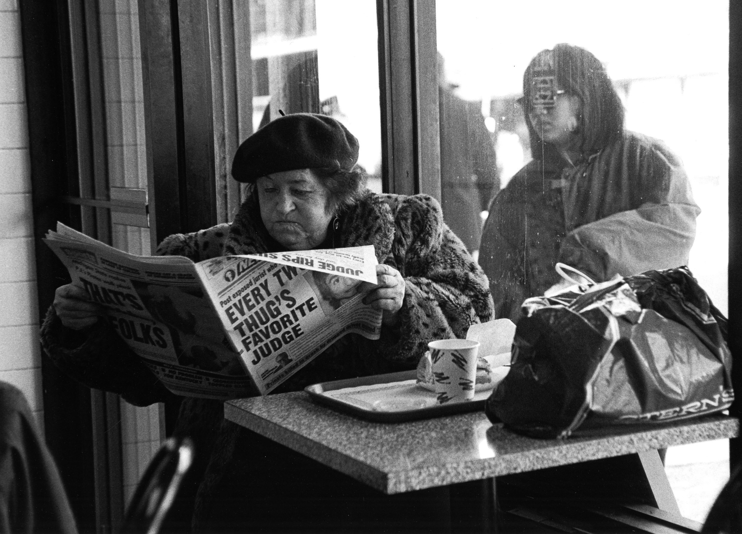   Reading the New York Post , 1995  Archival Inkjet Print  20 x 13 3/8" &nbsp;$800 