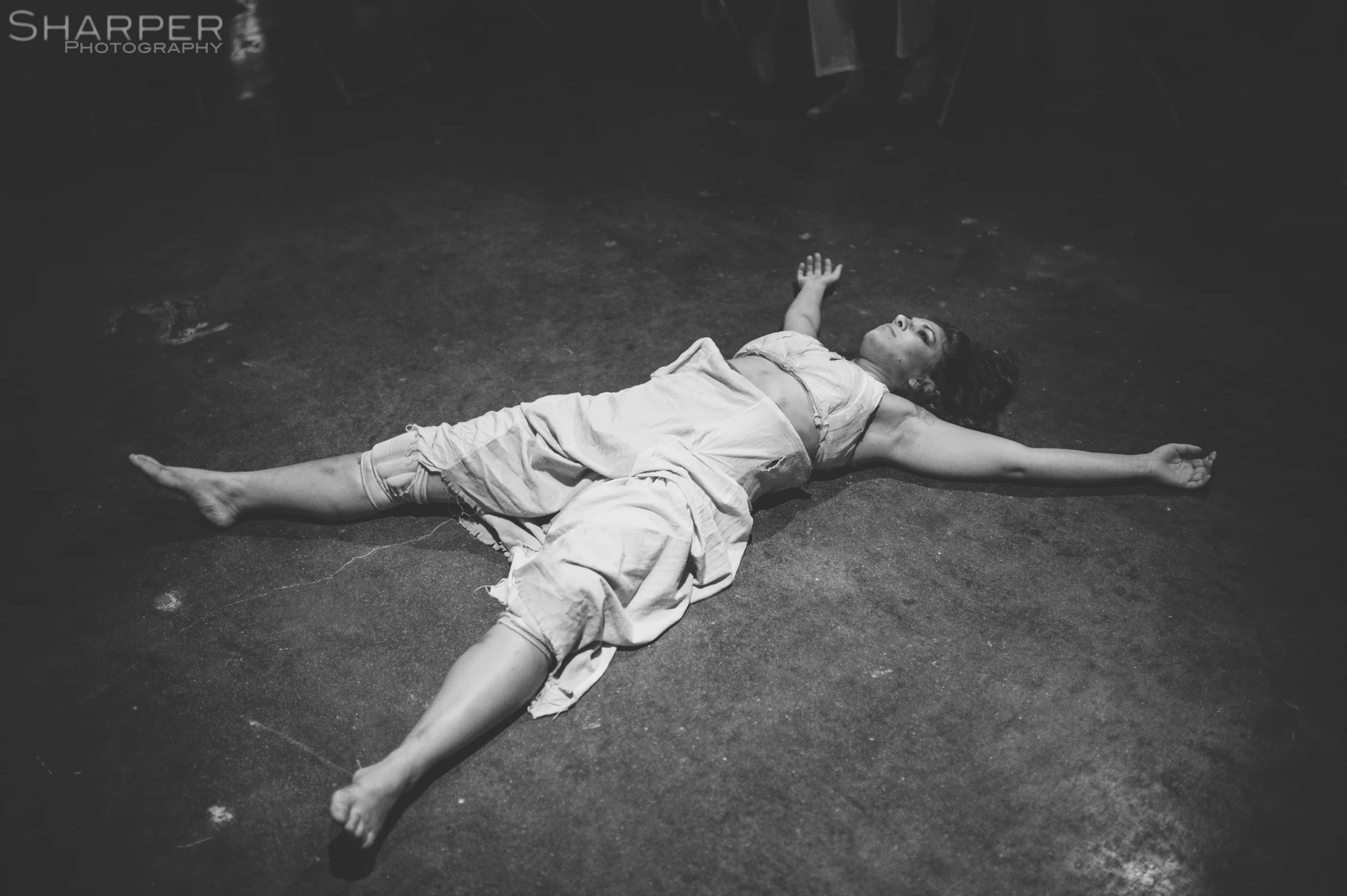 Black and white photo of dancer onstage during Austin theater event