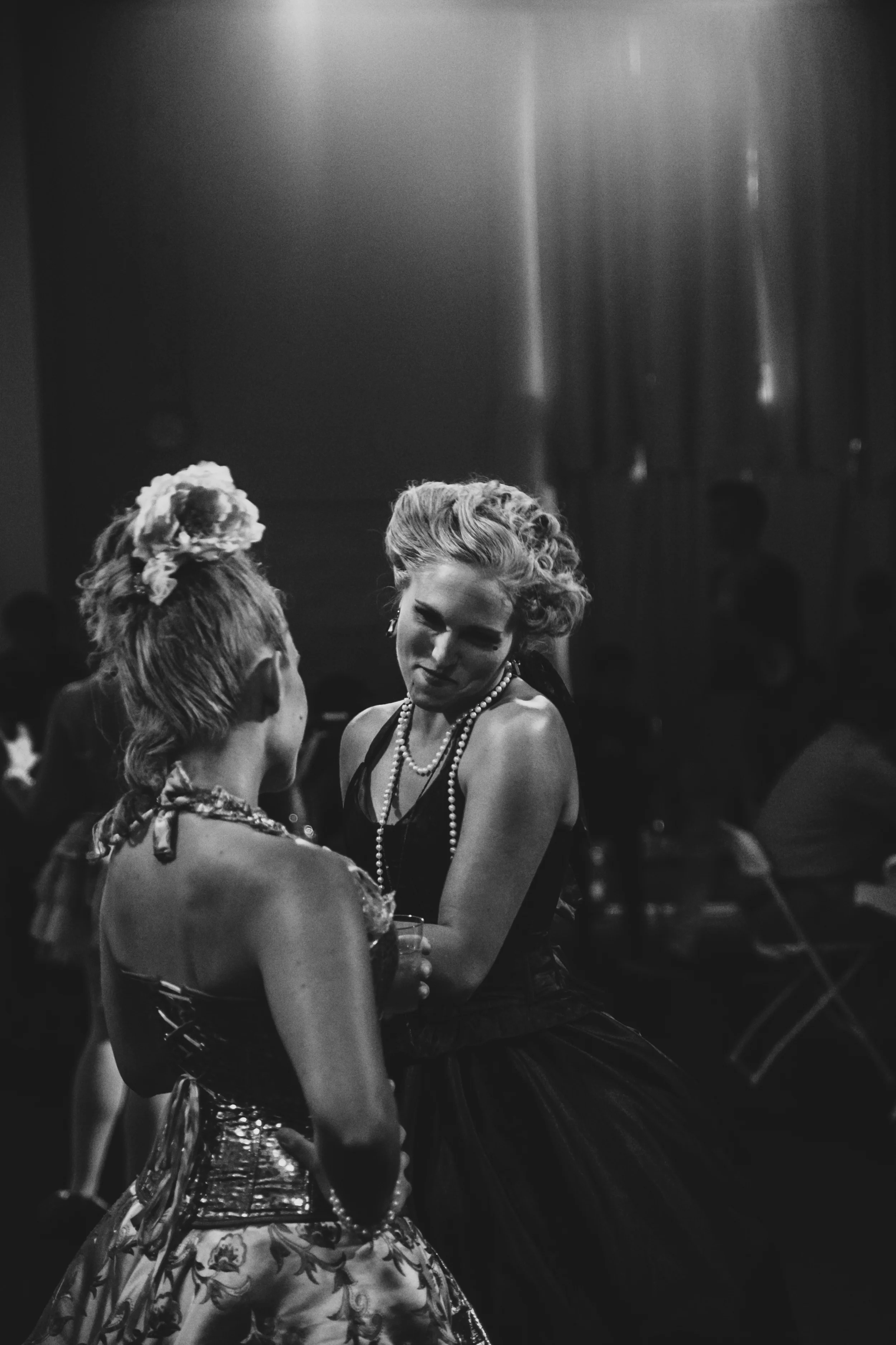 Black and white photo of actors performing at Austin interactive theater show