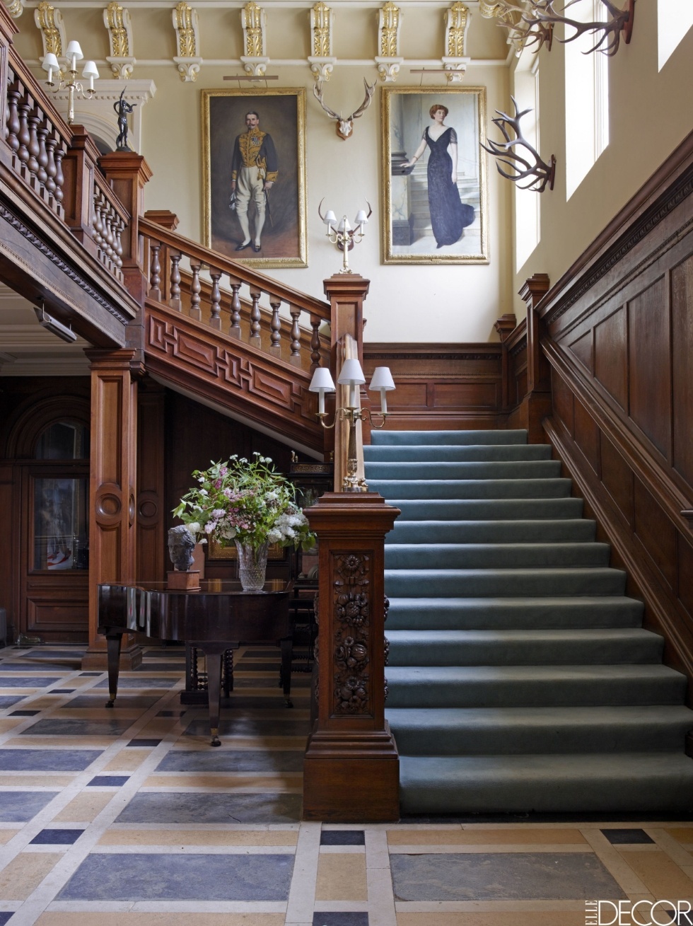 Loving the staircase in this English Estate . I love the color of the runner against the rich wood.