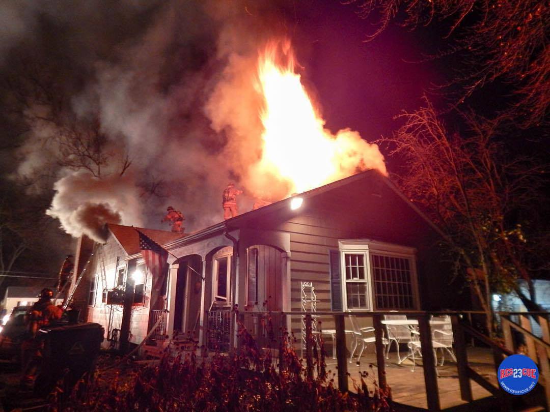 Fire venting from the rear of the home.