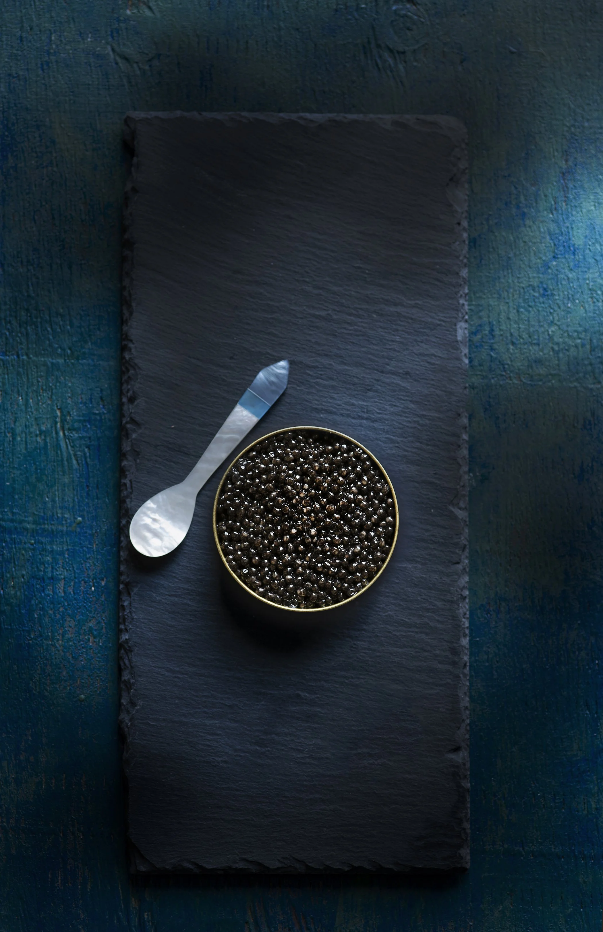 Caviar on a moody backdrop by Chicago food photographer