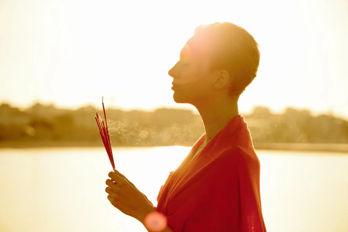 woman with incense burning.jpg