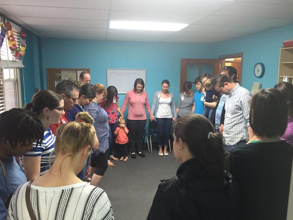 Children's ministry prayer huddle at The Journey - Tower Grove in St. Louis, MO. Photo by Jeff Hutchings.