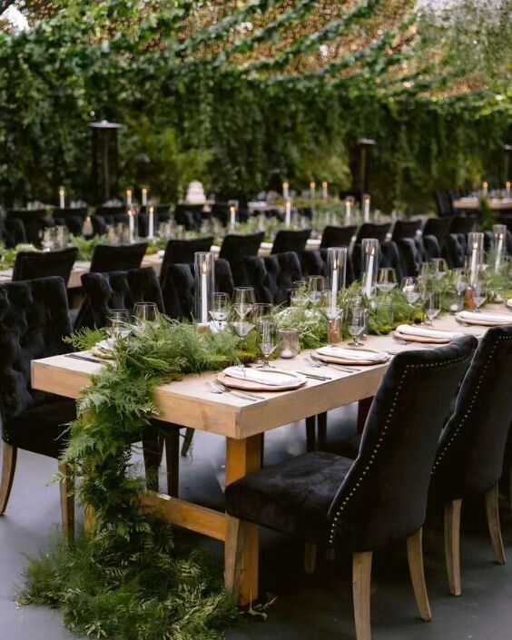 Wood elements, black velvet, and green foliage create the perfect environment for an enchanted forest wedding. It's still one of the favorites in our 20 years of weddings 💫

Venue: Private Estate
Tent Structure + Tables: @hensleyeventresources 
Chai