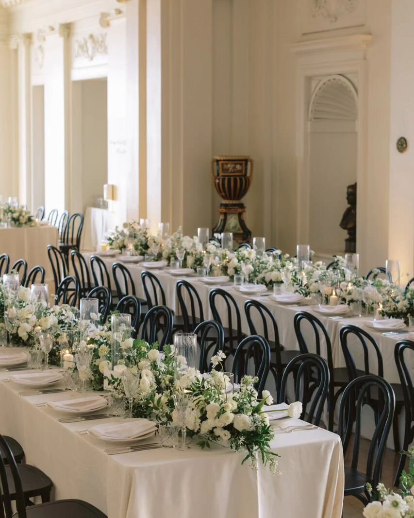Crisp ivory linens lined by sleek black chairs with tables topped with rows of gorgeous florals. Made  a perfect setting for this black tie wedding @floodmansion for M &amp; S last summer.

Photographer: @niravpatelweddings 
Linens + Tabletop: @brigh