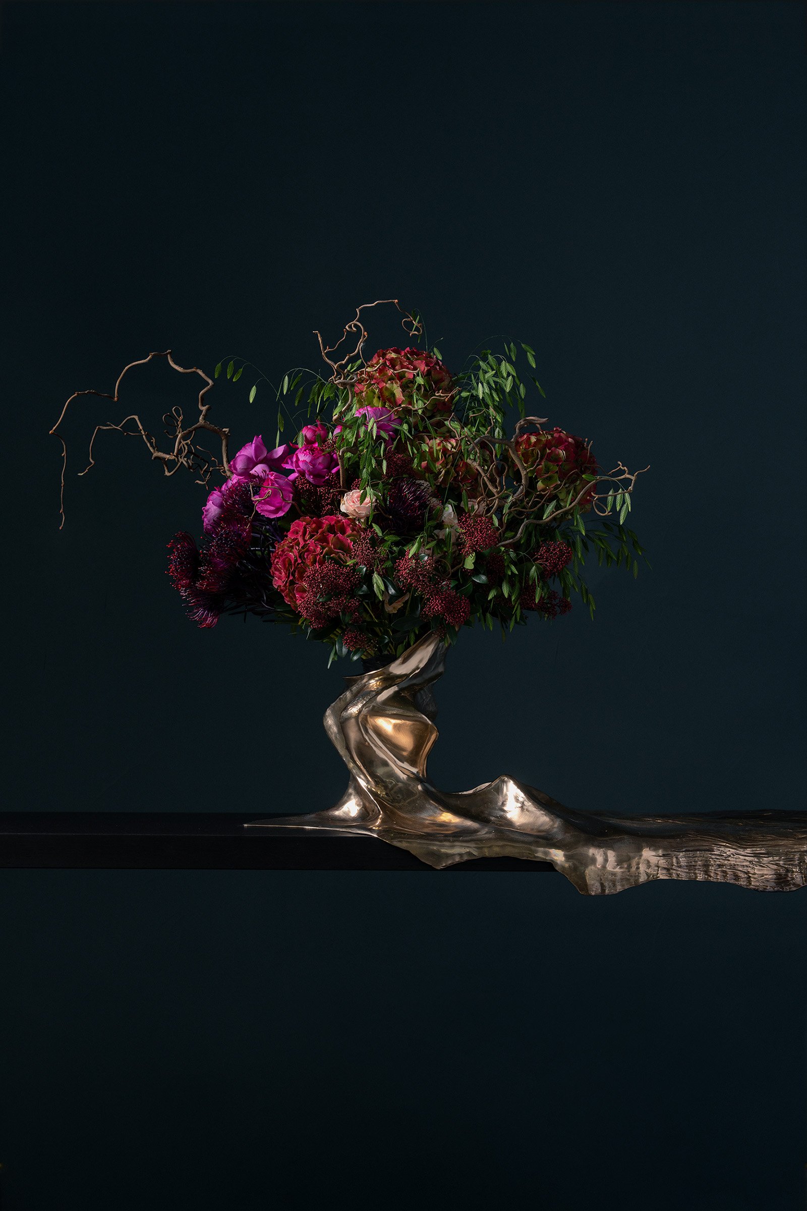 Close-up of flowing bronze legs in Every Breaking Wave Console, expressing organic continuity and sculptural movement, where the artist’s gesture remains visible within the cast bronze form.