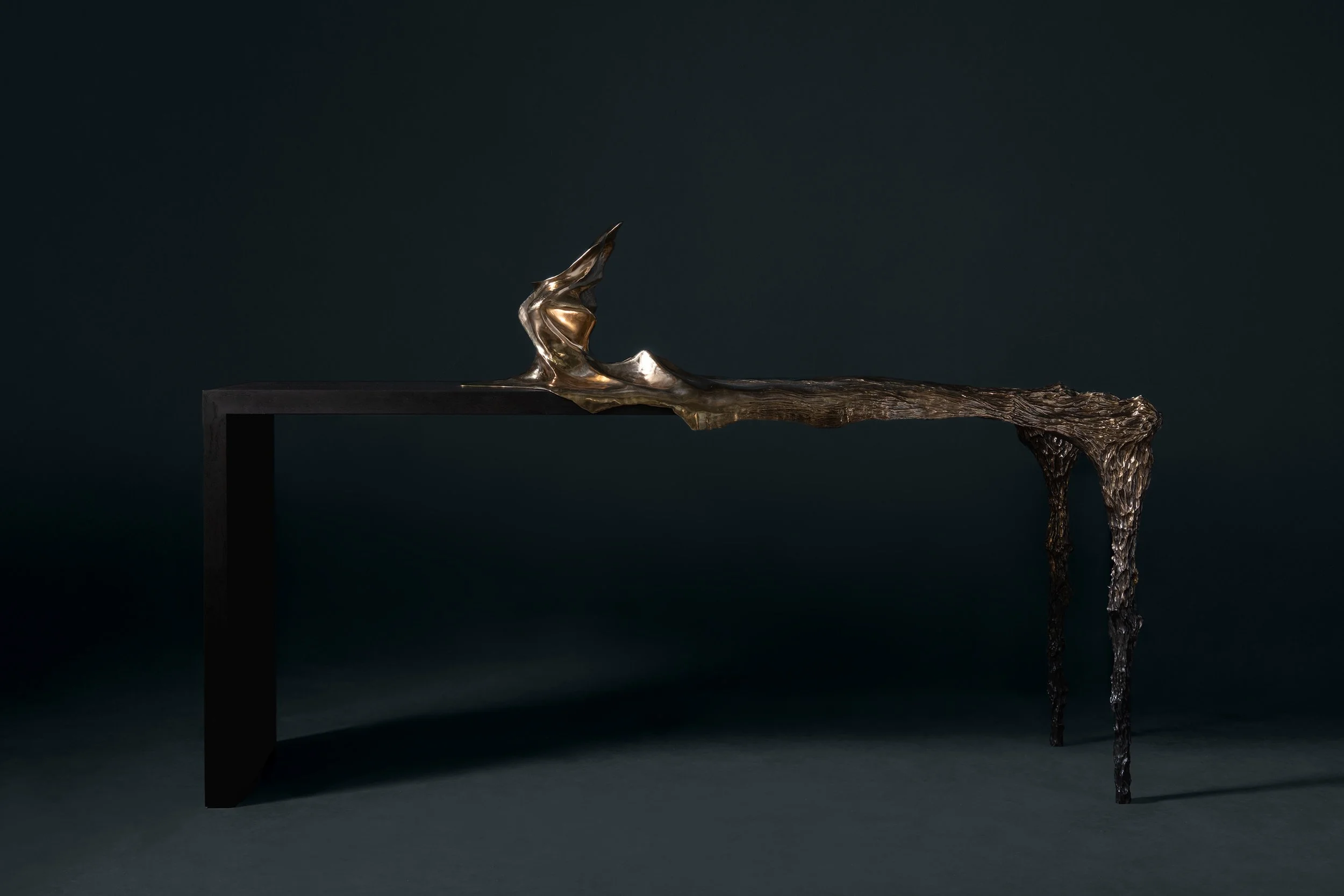 Full view of Every Breaking Wave Console, a luxury bespoke console where expressive cast bronze flows into sculptural wave-like forms, grounded by a minimal solid wood base that enhances its architectural presence.