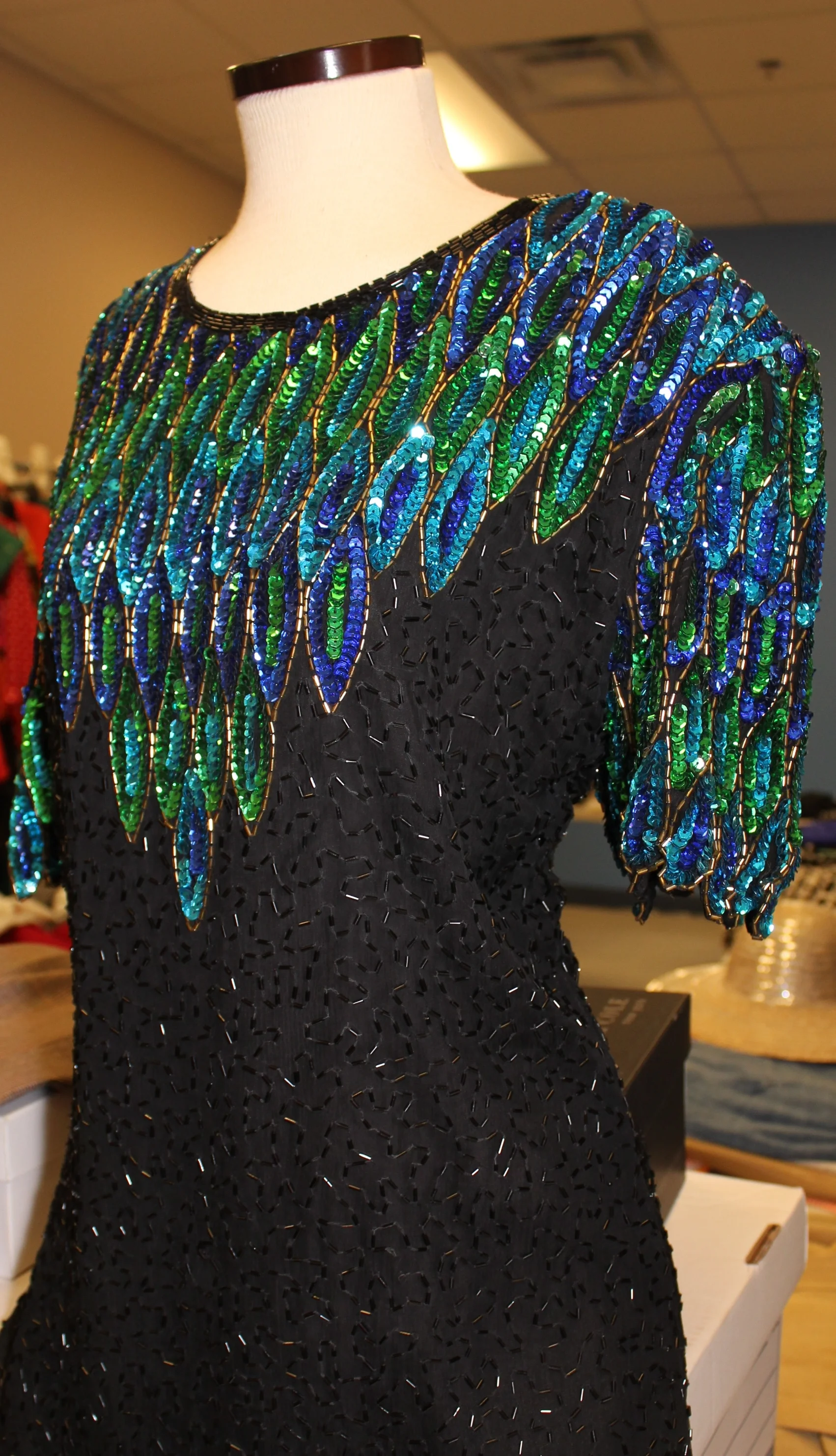 This amazing vintage dress has lots of sparkles - find one like it at a Goodwill store to wear to the Fashion Show, or grab this one from the Vintage Boutique for future outings.