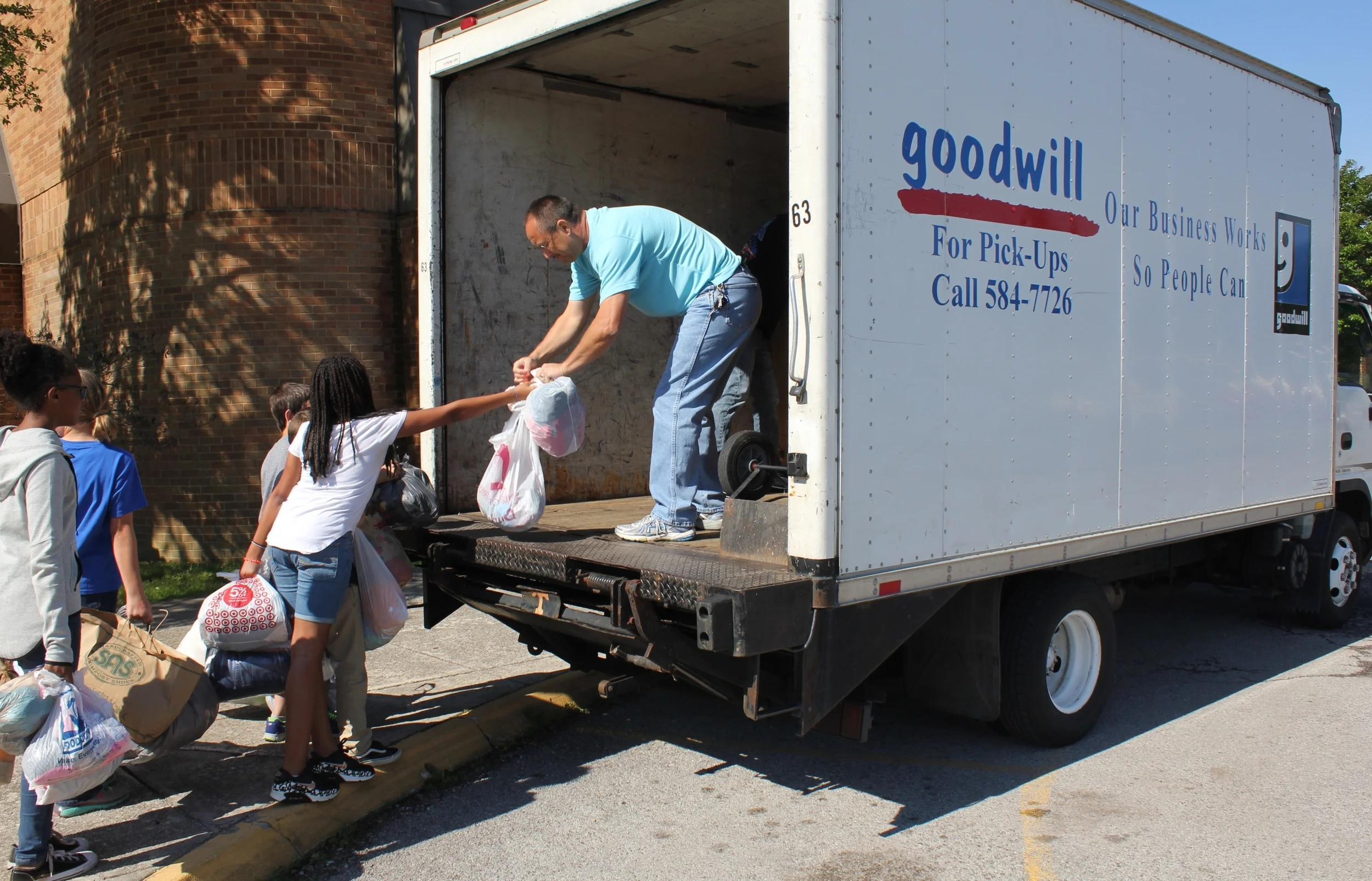 Students load up the truck at Karns Elementry.