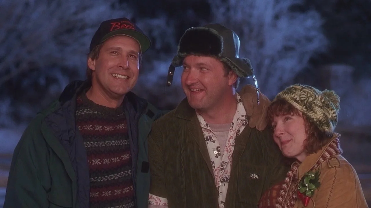 Chevy Chase sporting an ugly sweater in National Lampoon's Christmas Vacation