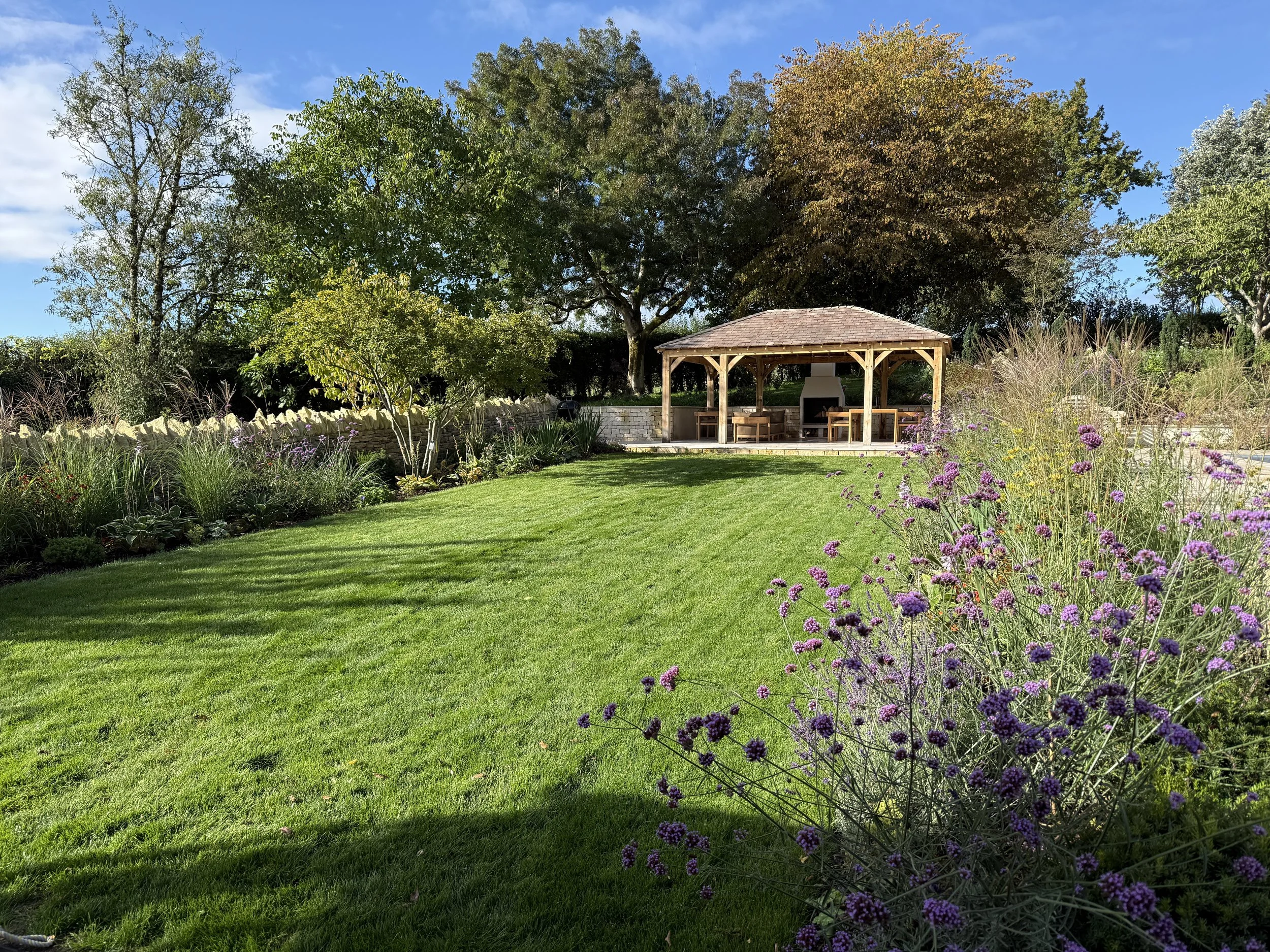 More formal lawn and planting between the new glass extension and the pool pavilion
