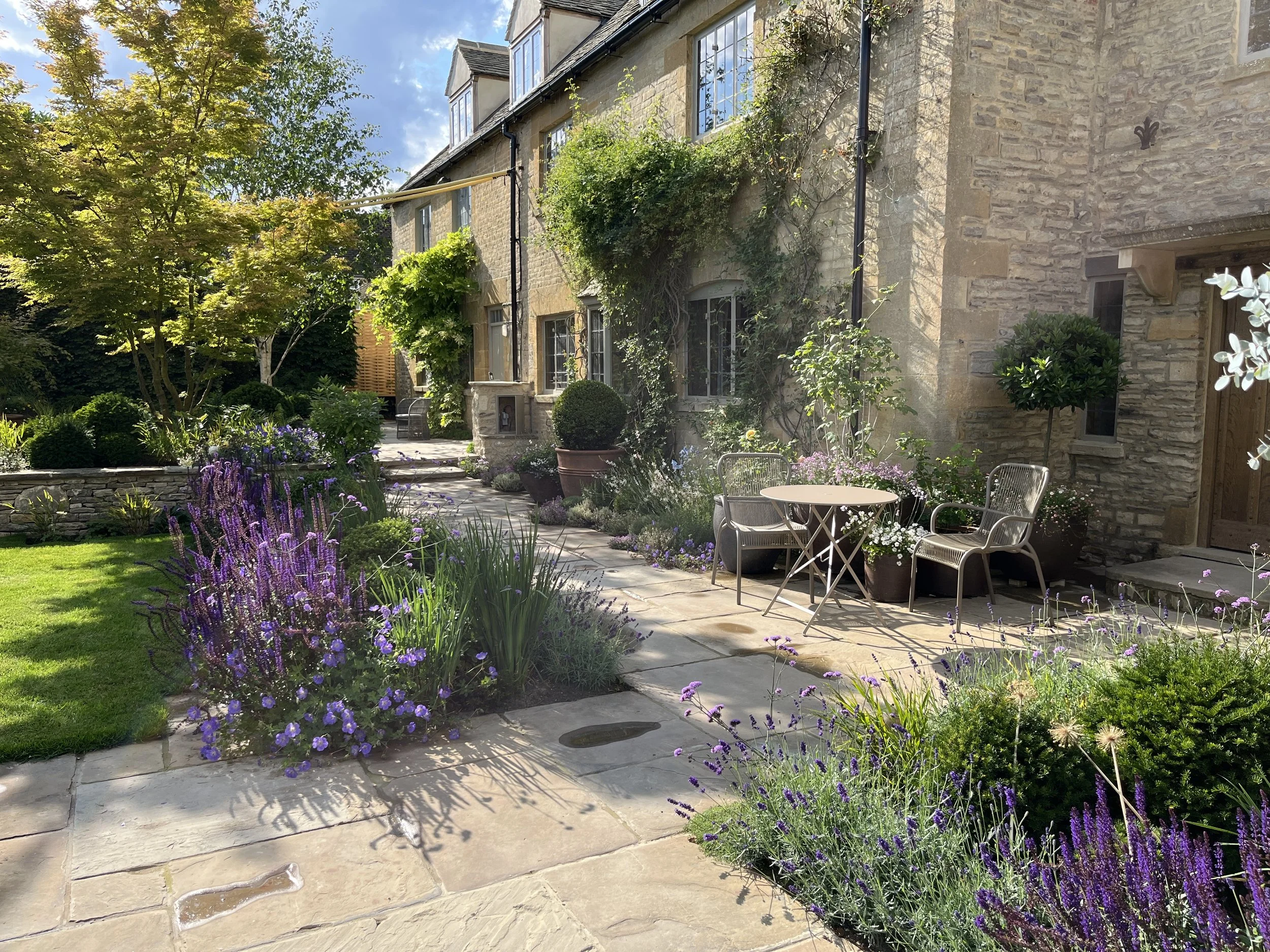 Cotswold style with reclaimed yorkstone paving.jpeg