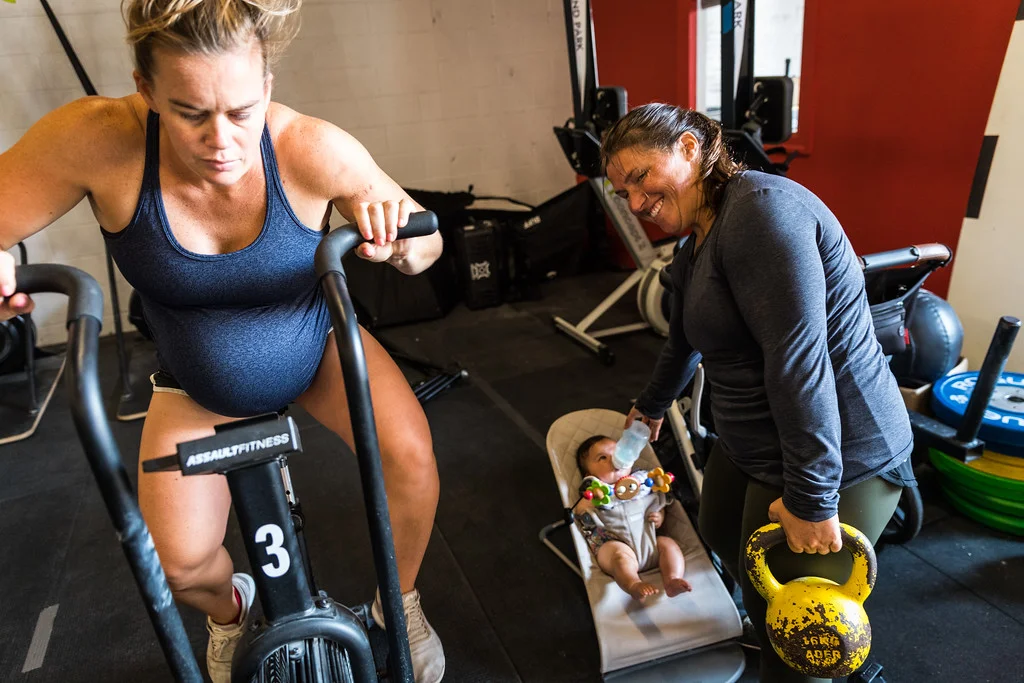 A couple of the fittest moms we know, Coach Kait Ilch & Keri Wisey (w/ Grace) Photo: @supercleary