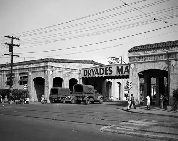 The historic Dryades Market buildings, situated at what is now the intersection of Oretha Castle Haley Boulevard and Martin Luther King, Jr. Boulevard. The building on the right now houses the Southern Food and Beverage Museum, and the New Orleans Jazz Market occupies the left building. This photo, courtesy of the New Orleans Public Library, shows the Market being used as a WAC recruiting station during WWII.