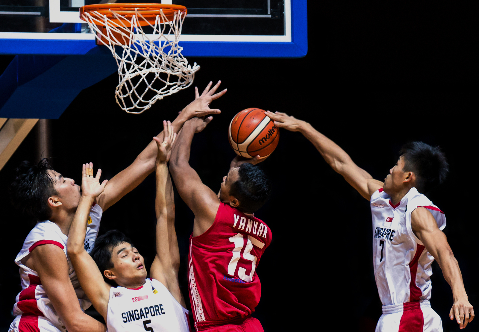 Yanuar Dwi Priasmoro (#15) of Indonesia goes for the layup against Singapore on day 3 of the 11th SEABA Championship at the OCBC Arena on April 29, 2015 in Singapore.