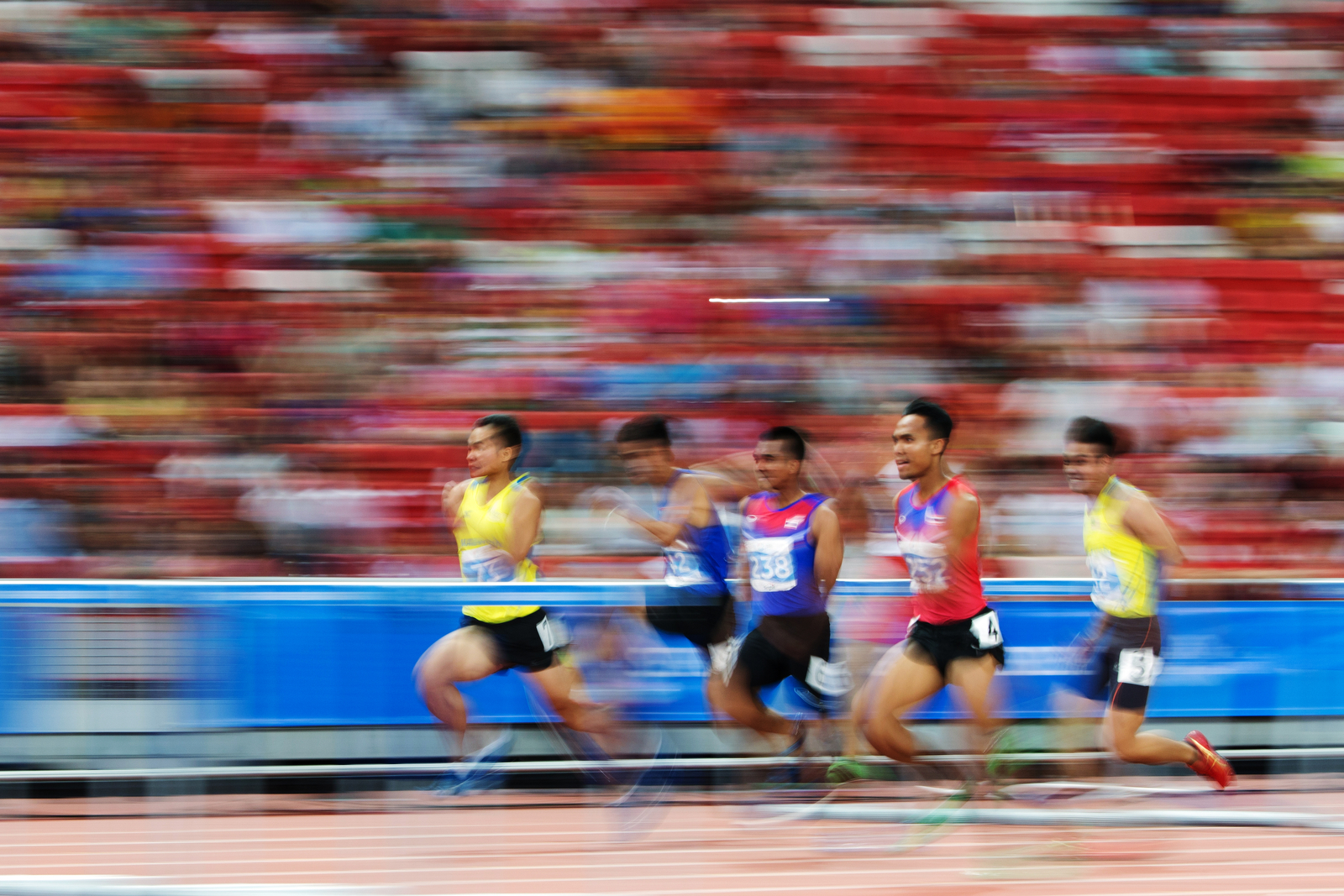 Competitors in action during the men's 110m hurdles final at the 28th Southeast Asian Games at the National Stadium on June 11, 2015 in Singapore.