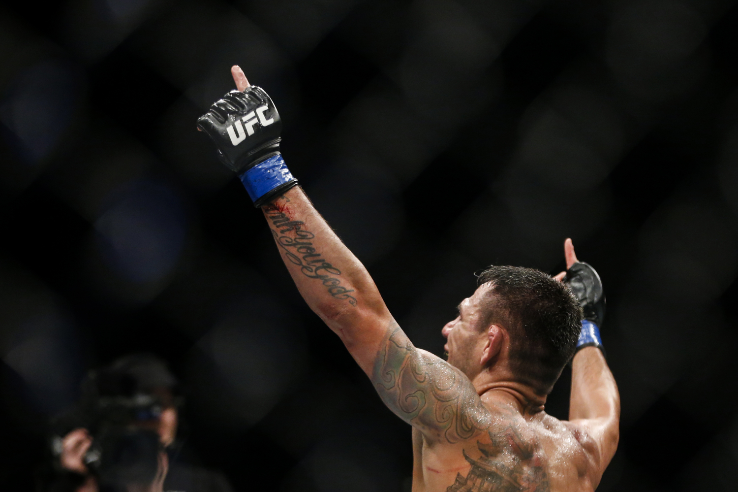  Rafael dos Anjos of Brazil celebrates his welterweight bout win over Tarec Saffiedine of Belgium at the UFC Fight Night at the Singapore Indoor Stadium on June 17, 2017. 