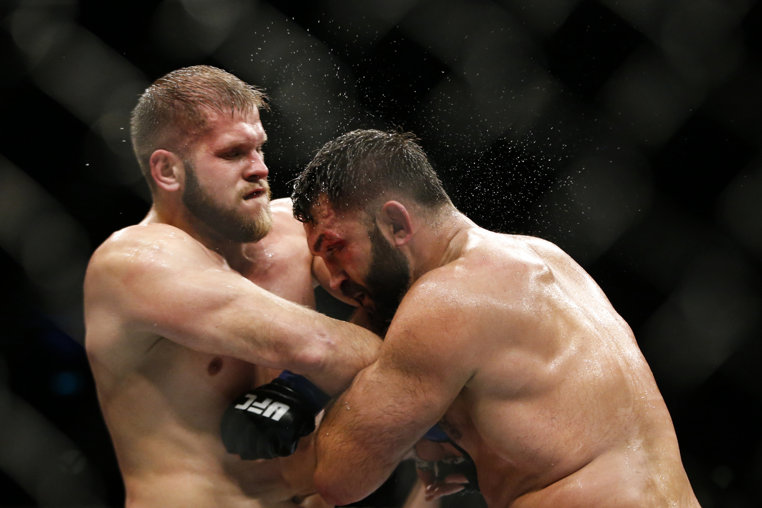  Andrei Arlovski (R) of Belarus fights Marcin Tybura of Poland during their heavyweight bout at the UFC Fight Night at the Singapore Indoor Stadium on June 17, 2017. 
