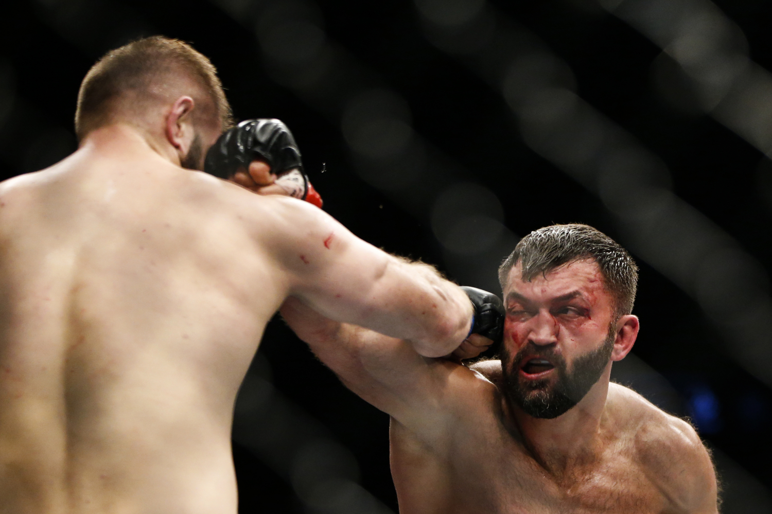  Andrei Arlovski (R) of Belarus fights Marcin Tybura of Poland during their heavyweight bout at the UFC Fight Night at the Singapore Indoor Stadium on June 17, 2017. 