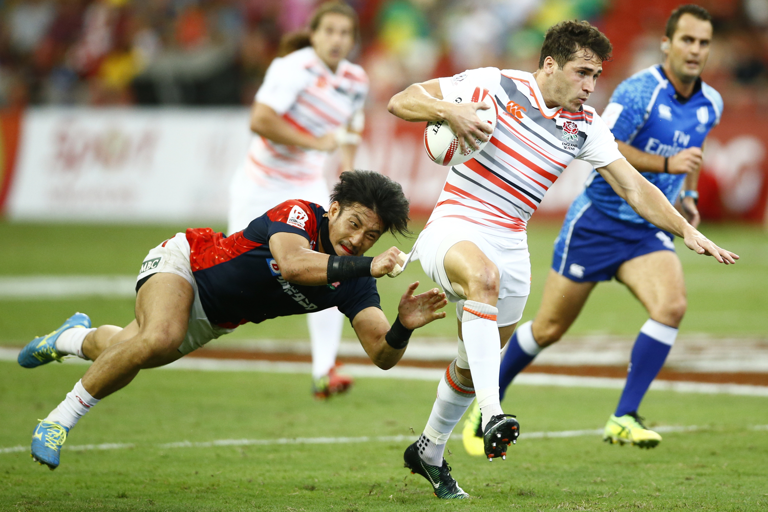  Rugby Union - Singapore Sevens - National Stadium, Singapore, 15/04/17 - England's Oliver Lindsay-Hague is tackled by Japan's Dai Ozawa. REUTERS/Yong Teck Lim 