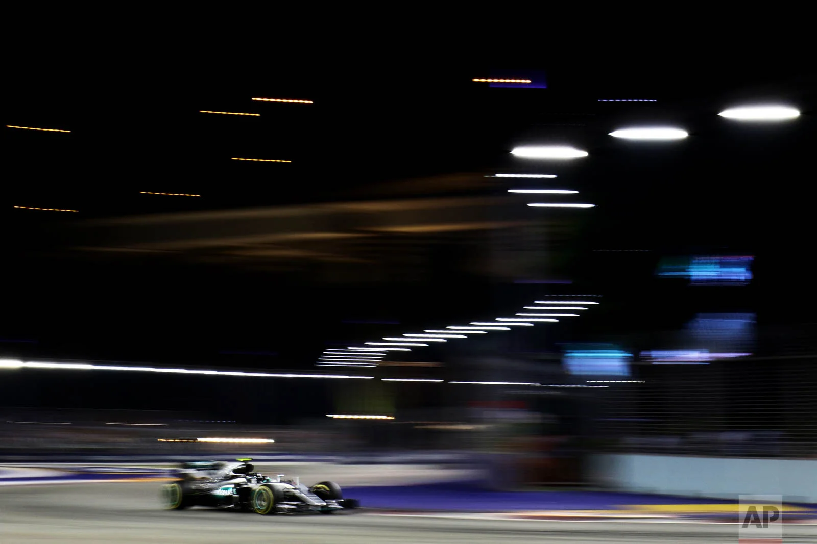 Mercedes Driver Nico Rosberg of Germany steers his car during the Singapore Formula One Grand Prix on the Marina Bay City Circuit in Singapore, Sunday, Sept. 18, 2016. (AP Photo/Yong Teck Lim)