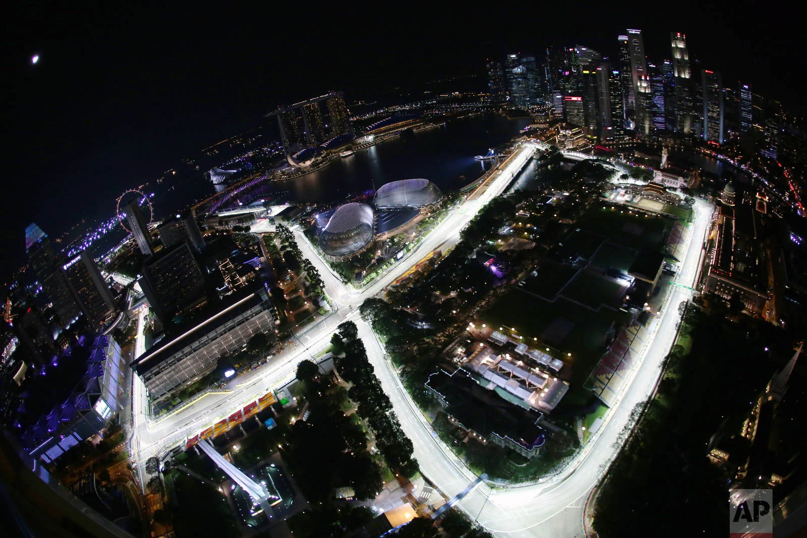 The Singapore Grand Prix's Marina Bay City Circuit taken with a fish-eye lens from a hotel suite in Swissotel The Stamford in Singapore is seen on Thursday, Sept. 15, 2016. (AP Photo/Yong Teck Lim)