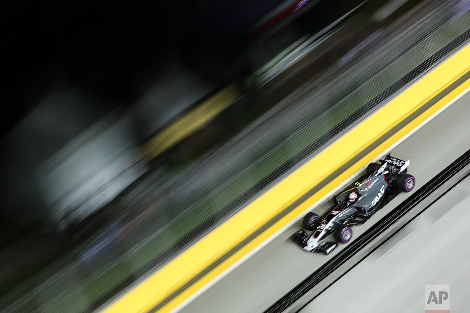  Haas driver Kevin Magnussen of Denmark steers his car during the second practice session at the Singapore Formula One Grand Prix on the Marina Bay City Circuit Singapore, Friday, Sept. 15, 2017. (AP Photo/Yong Teck Lim) 