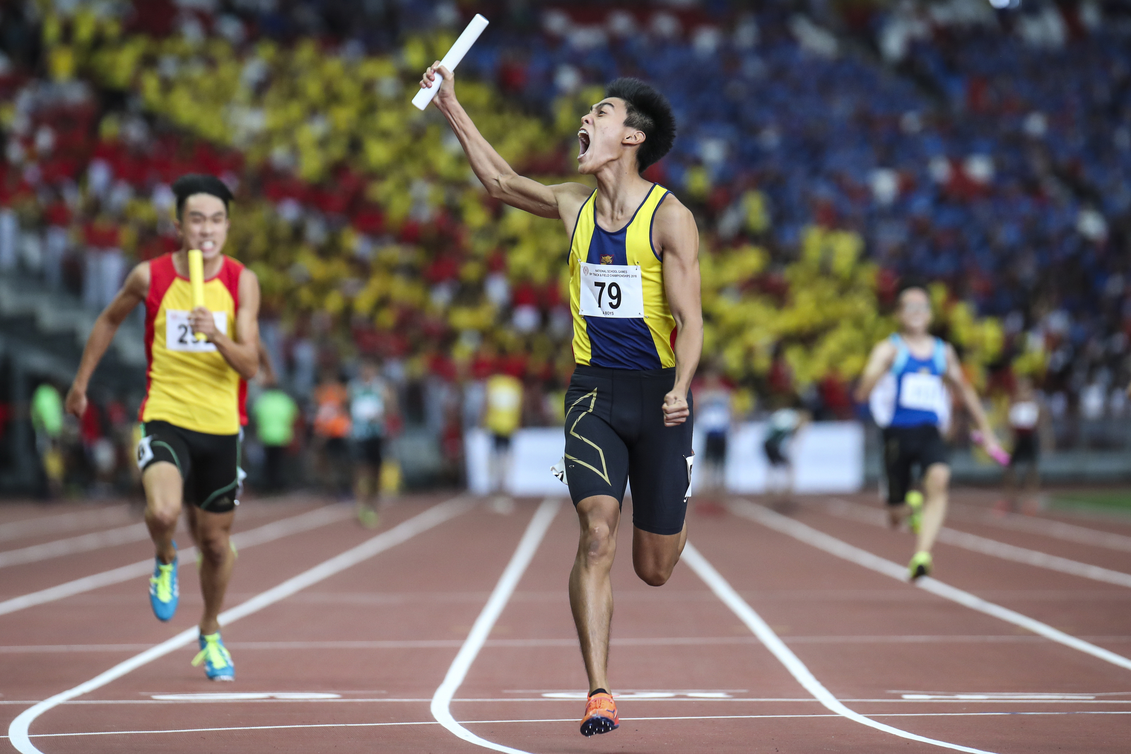 Joshua Lim of Anglo-Chinese School (Independent) celebrates after anchoring his team to win the National Schools boys’ ‘A’ Division boys' 4x100m relay final at the National Stadium on April 12, 2018 in Singapore. (Photo © Yong Teck Lim/Red Sports)