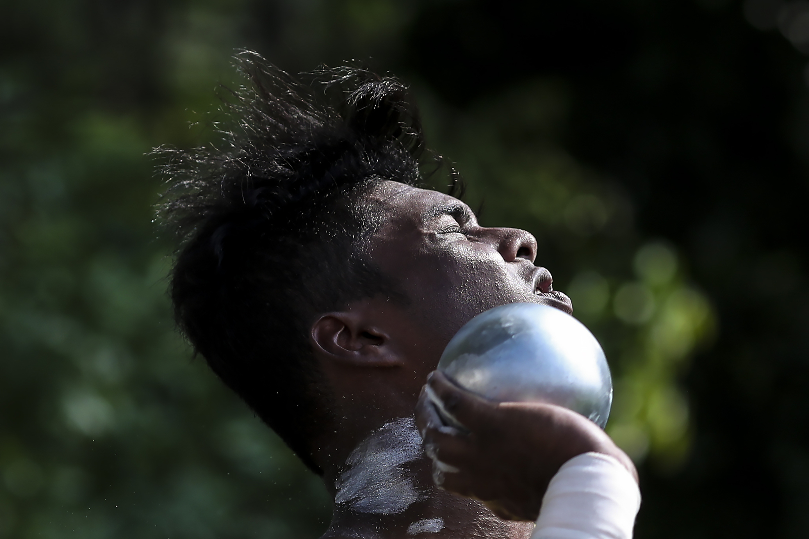 Barathan S/O Murugiah of Anglo-Chinese Junior College in action during the National Schools boys' 'A' Division shot put final at the Choa Chu Kang Stadium on April 3, 2018 in Singapore. (Photo © Yong Teck Lim/Red Sports)