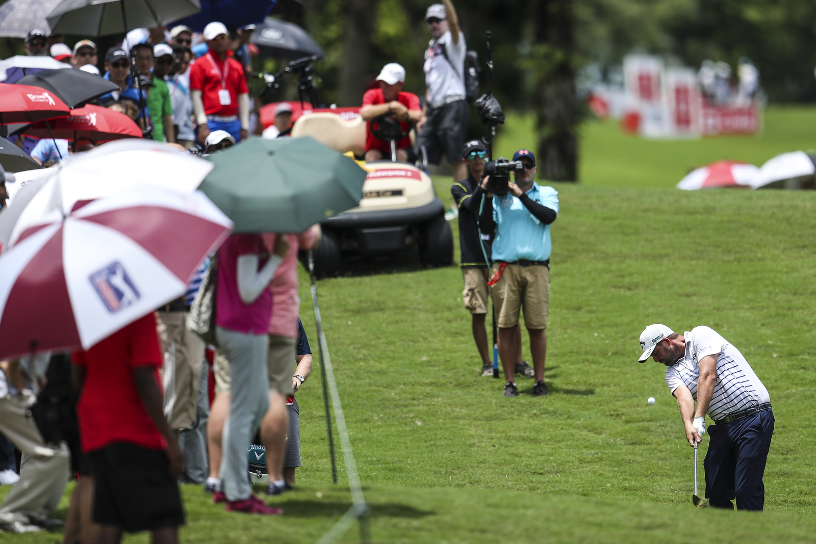  KUALA LUMPUR, MALAYSIA - OCTOBER 14: Marc Leishman of Australia plays his shot on the 12th green during the final round of the CIMB Classic at TPC Kuala Lumpur on October 14, 2018 in Kuala Lumpur, Malaysia. (Photo by Yong Teck Lim/Getty Images) 