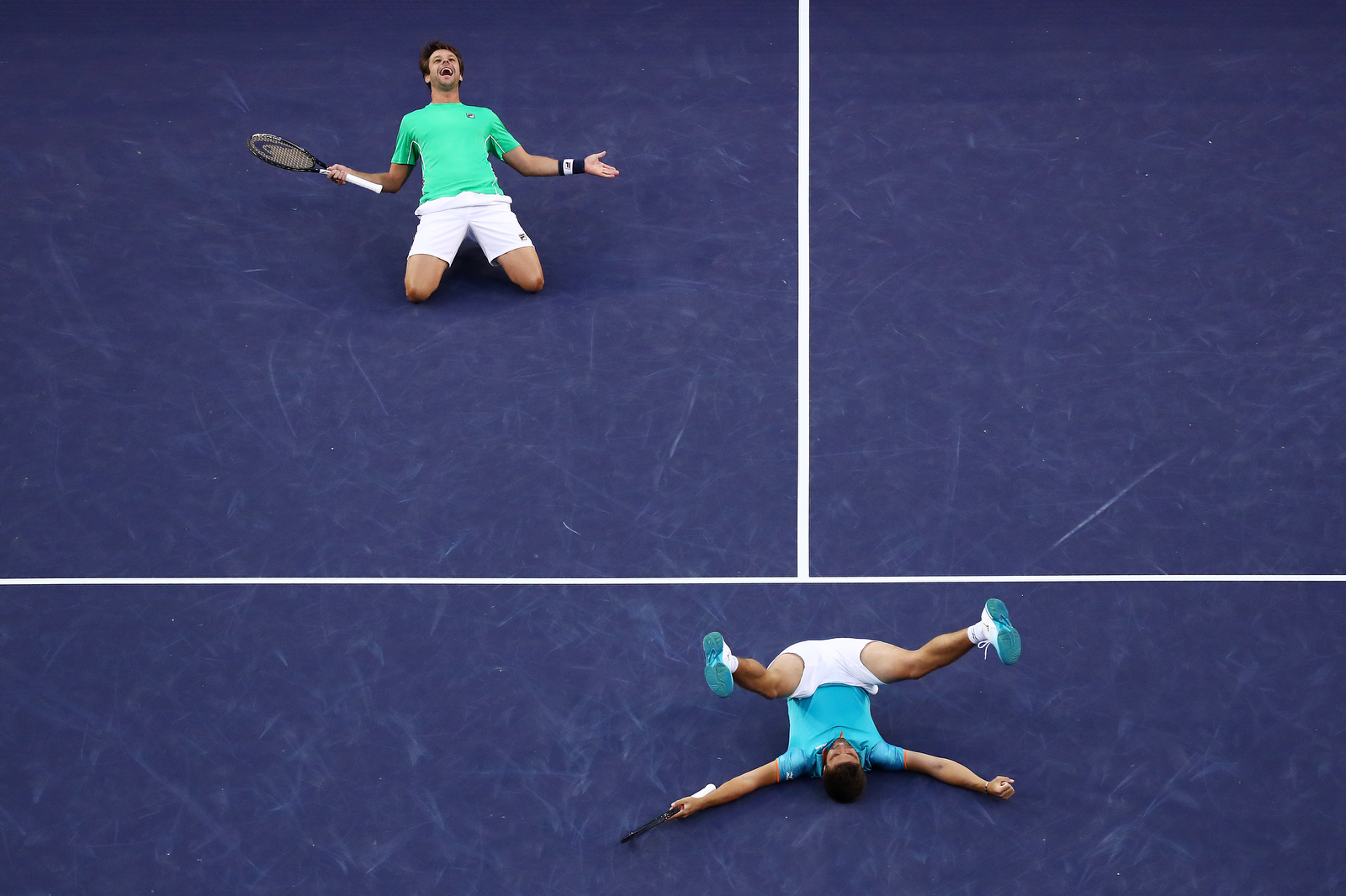  INDIAN WELLS, CALIFORNIA - MARCH 16: Nikola Mektic of Croatia and Horacio Zeballos of Argentina celebrate their men's doubles final match victory against Lukasz Kubot of Poland and Marcelo Melo of Brazil on Day 13 of the BNP Paribas Open at the Indi