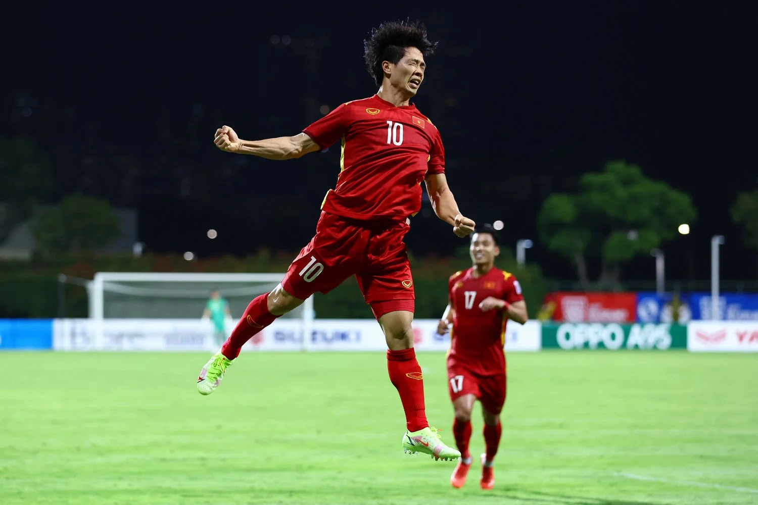  SINGAPORE, SINGAPORE - DECEMBER 12: Nguyen Cong Phuong #10 of Vietnam celebrates after scoring his team's second goal against Malaysia during the first half of their AFF Suzuki Cup Group B game at Bishan Stadium on December 12, 2021 in Singapore. (P