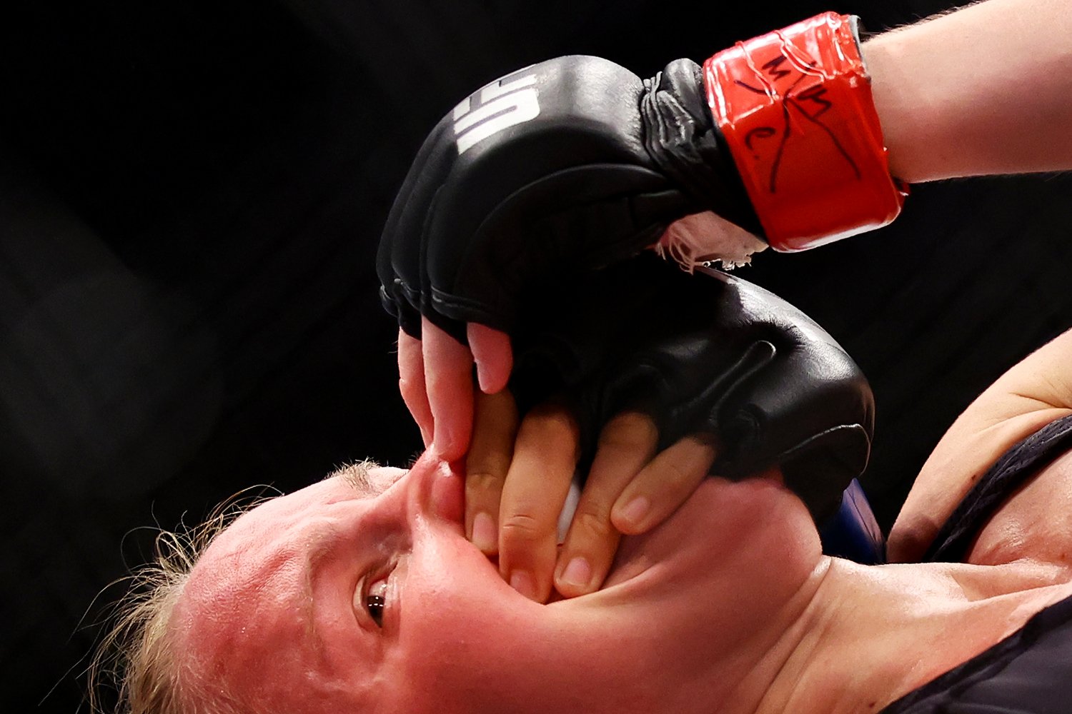  SINGAPORE, SINGAPORE - JUNE 12: Valentina Shevchenko of Kyrgyzstan reacts as she grapples with Taila Santos of Brazil in their flyweight title bout during UFC 275 at Singapore Indoor Stadium on June 12, 2022 in Singapore. (Photo by Yong Teck Lim/Get