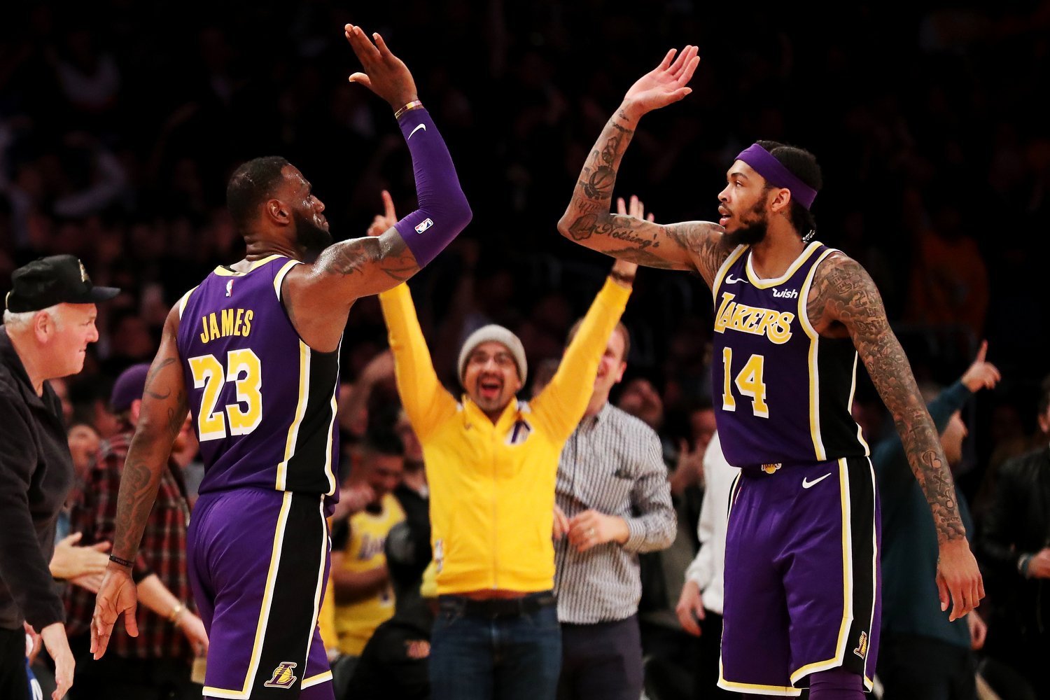  LOS ANGELES, CALIFORNIA - FEBRUARY 27: LeBron James #23 of the Los Angeles Lakers celebrates with Brandon Ingram #14 after making a three-pointer against Jrue Holiday #11 of the New Orleans Pelicans during the second half at Staples Center on Februa