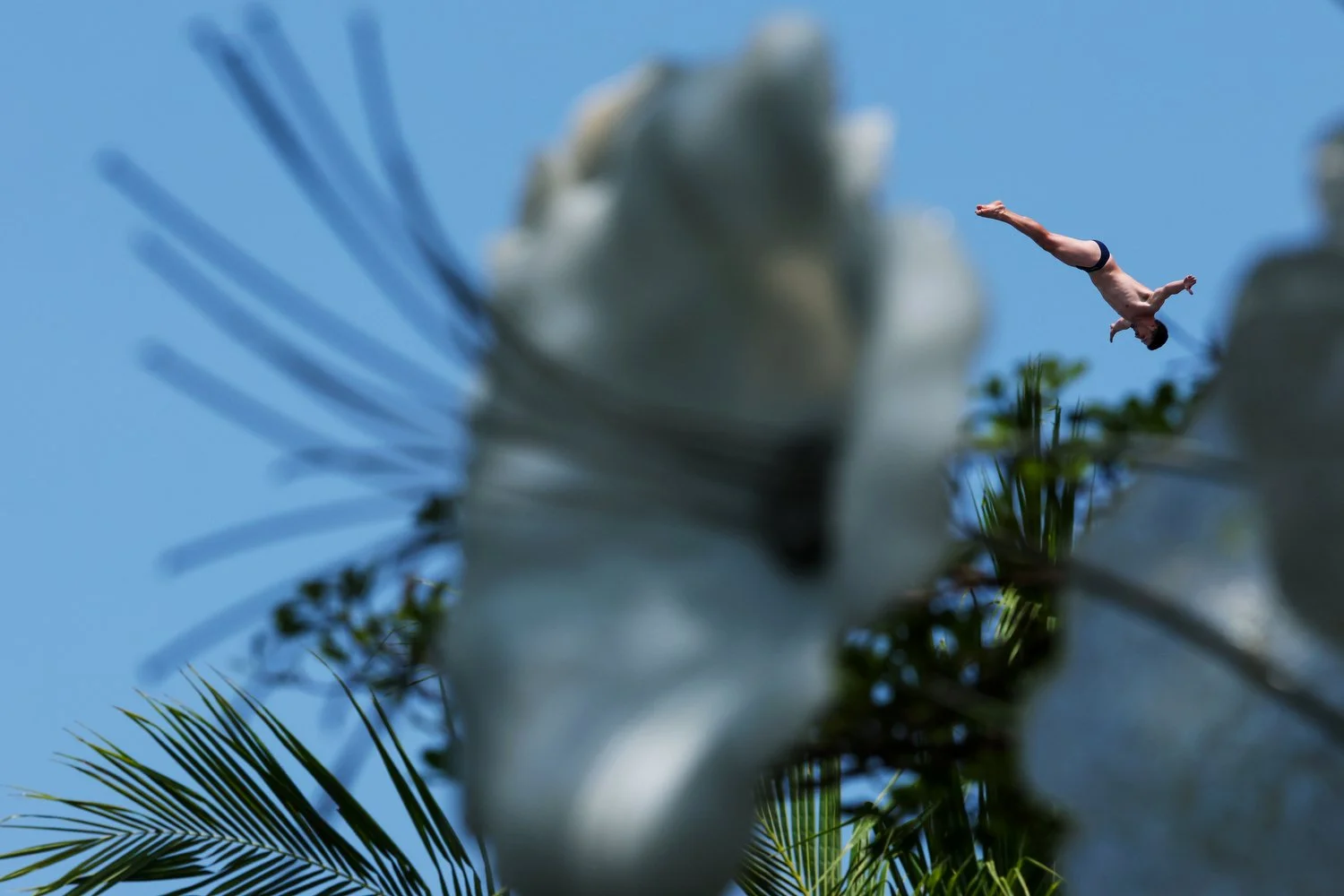  SINGAPORE, SINGAPORE - JULY 24: Jean-David Duval of Team Switzerland competes in the Men's 27m Platform High Diving Rounds 1-2 on day 14 of the Singapore 2025 World Aquatics Championships at The Palawan @ Sentosa on July 24, 2025 in Singapore. (Phot