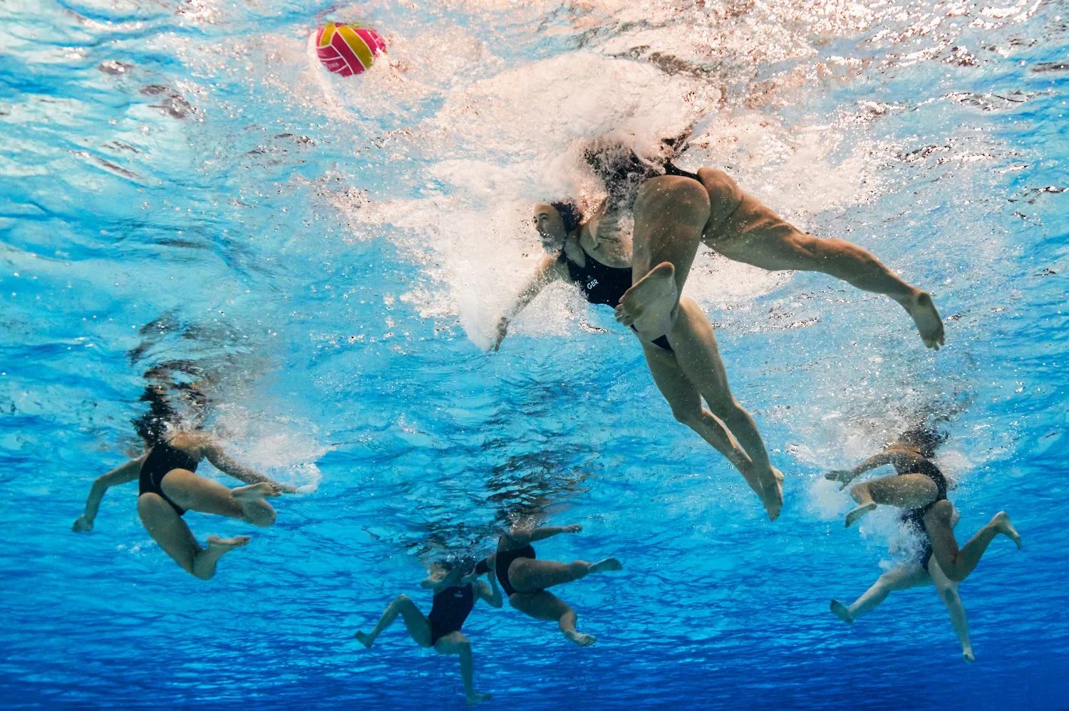  SINGAPORE, SINGAPORE - JULY 19:  (EDITORS NOTE: Image was captured using an underwater robotic camera.) Kathy Rogers of Team Great Britain is fouled in the Women's Water Polo classification 9-12 match between New Zealand and Great Britain on day nin