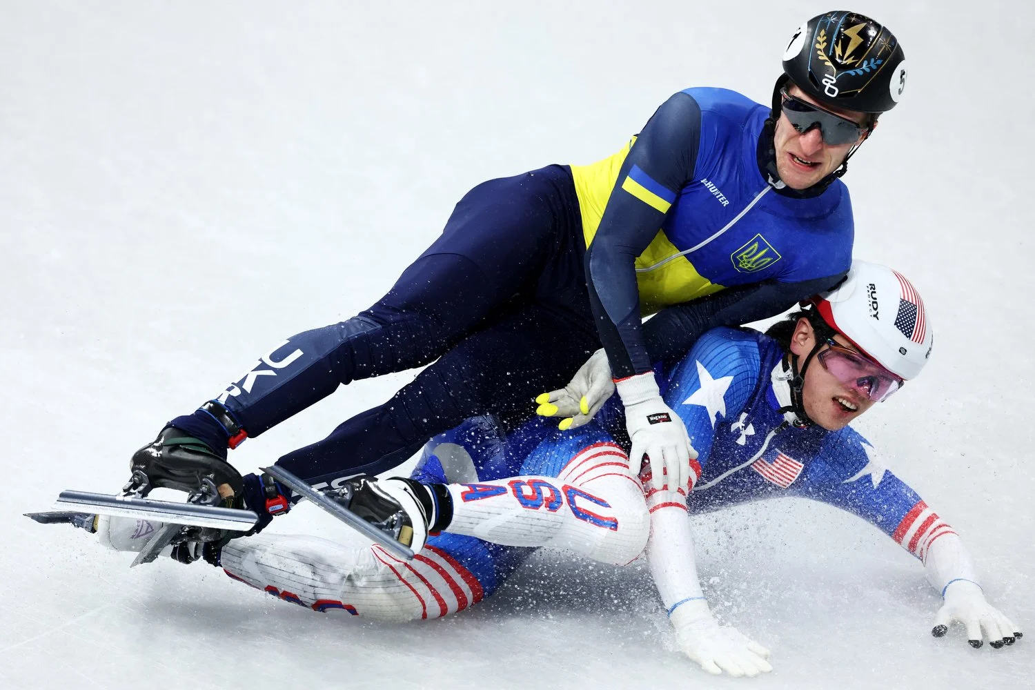  MILAN, ITALY - FEBRUARY 16: Oleh Handei of Team Ukraine and Brandon Kim of Team United States crash during heat 7 of the Short Track Speed Skating Men's 500m on day ten of the Milano Cortina 2026 Winter Olympic games at Milano Ice Skating Arena on F
