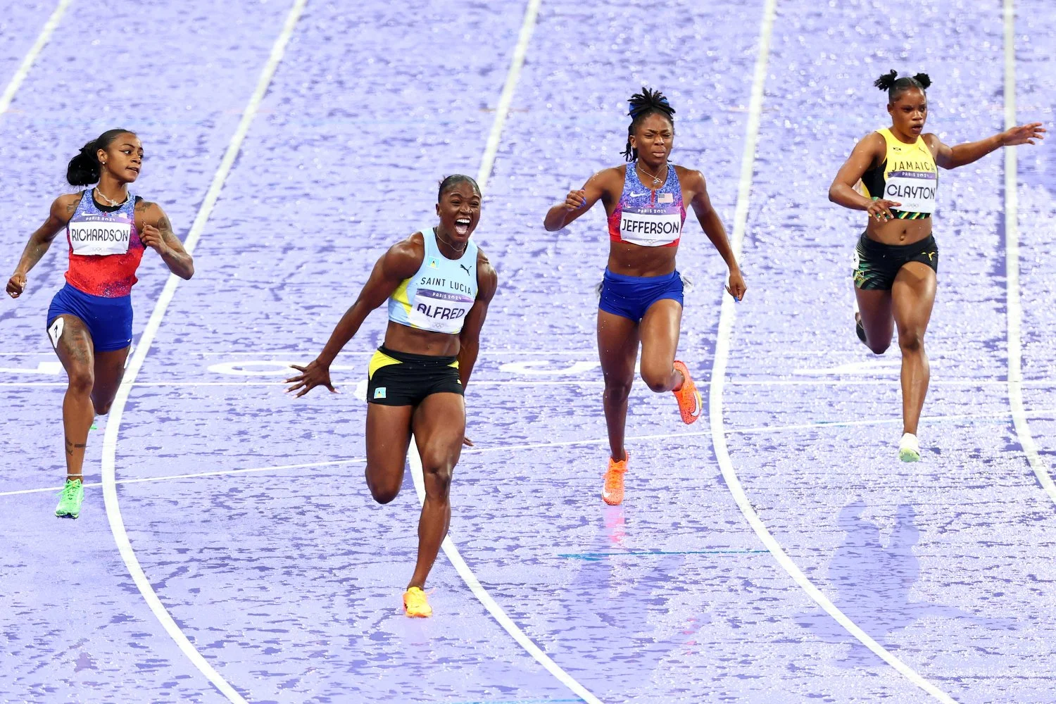  PARIS, FRANCE - AUGUST 03: Julien Alfred of Team Saint Lucia crosses the finish line to win the Women's 100m Final on day eight of the Olympic Games Paris 2024 at Stade de France on August 03, 2024 in Paris, France. (Photo by Yong Teck Lim/Getty Ima