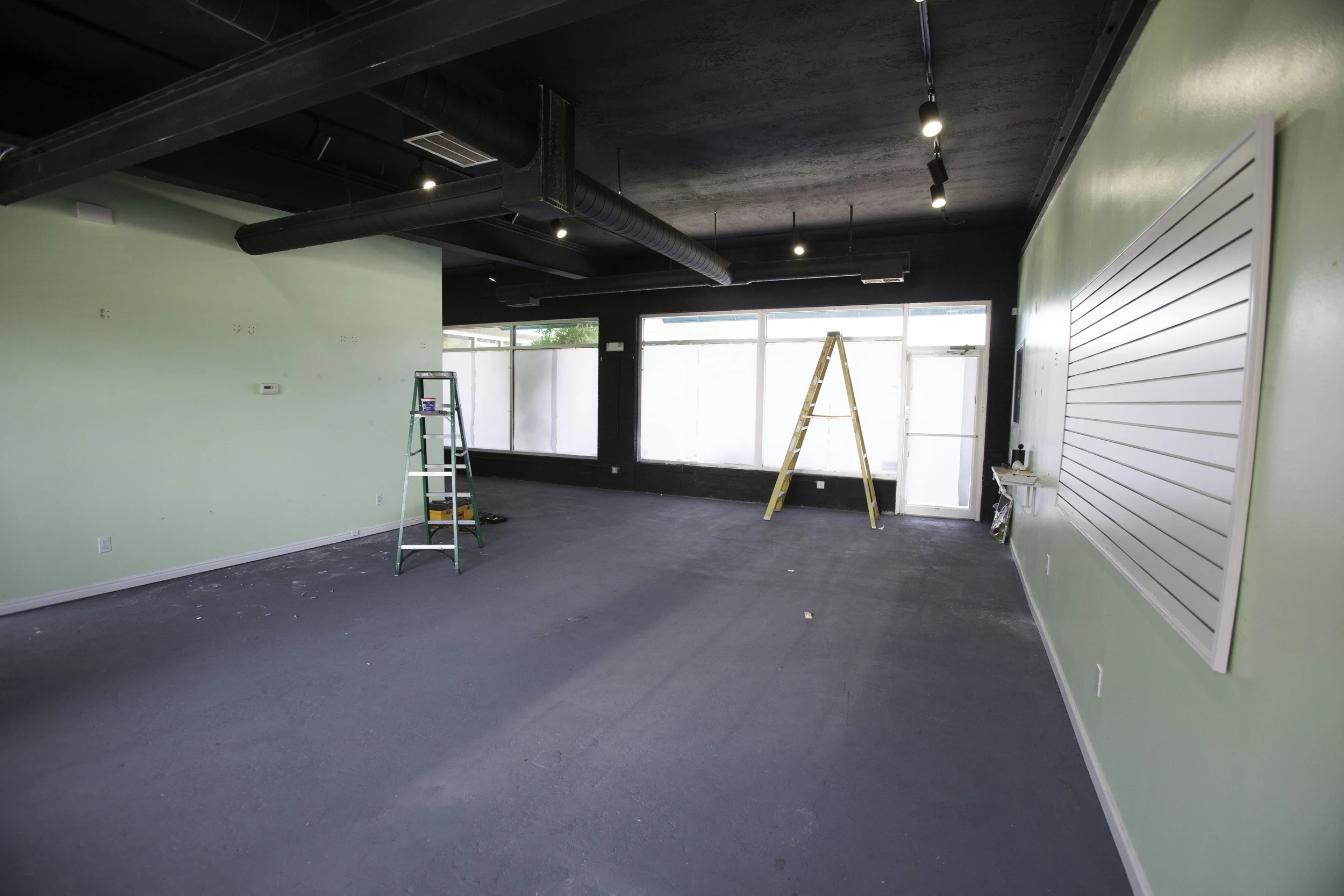 A before view from inside the studio looking towards the entrance.