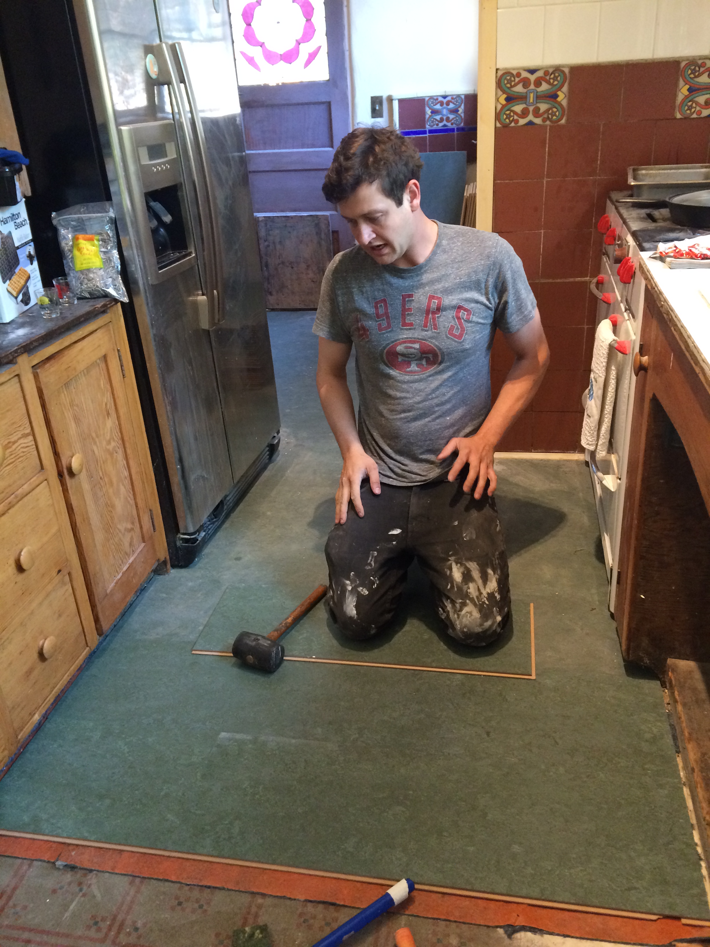 Evan working on the Marmoleum installation