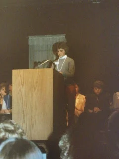 Sara reading her piece at the Landmark Center in 1986