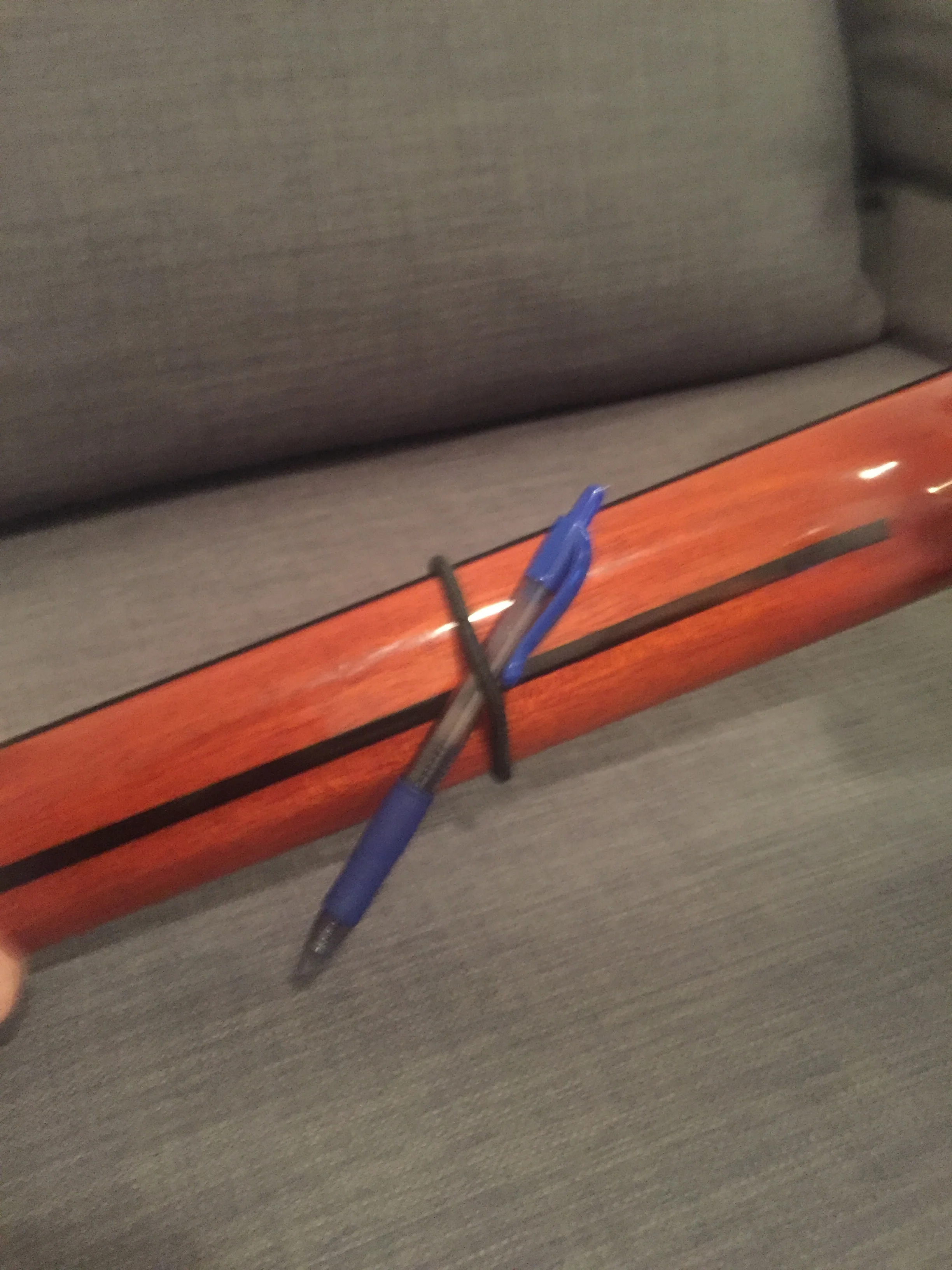 Step 2 - if needed, adjust tightness with a pen. We used one with a rubber grip so it wouldn't slip around as much.