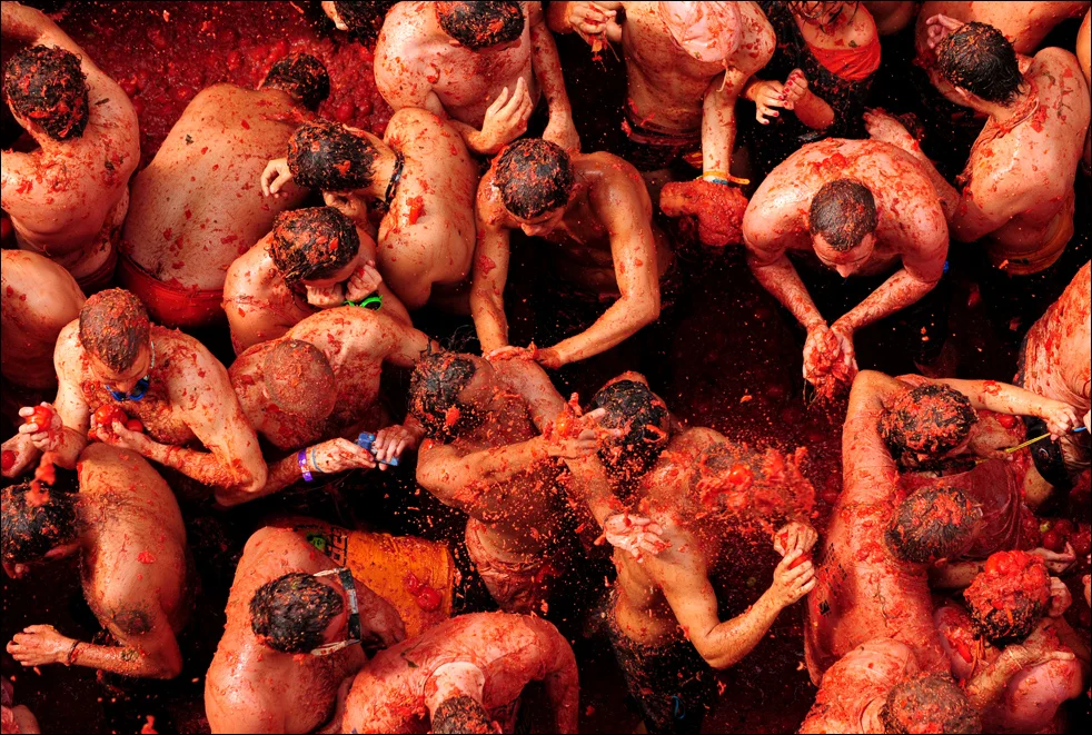 People enjoying the tomato fight at La Tomatina