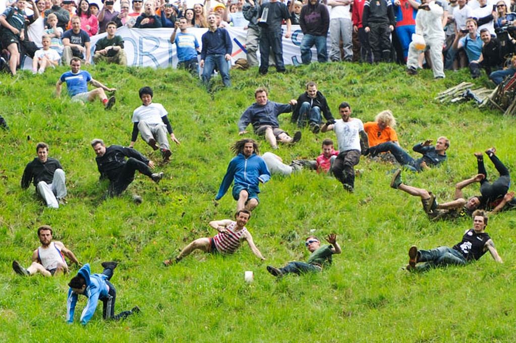 Competitors run after the round of cheese at the Cooper's Hill Cheese Rolling and Wake
