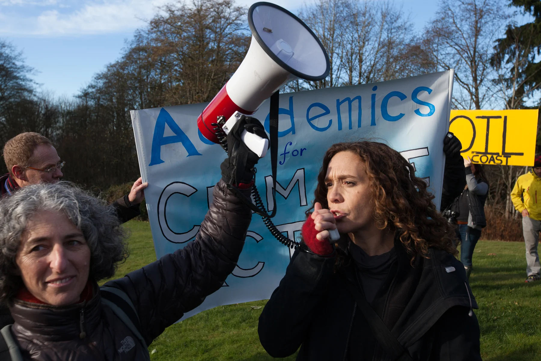 Professors and scientists gather at an "Academics for Climate Action" rally on Burnaby Mountain. 