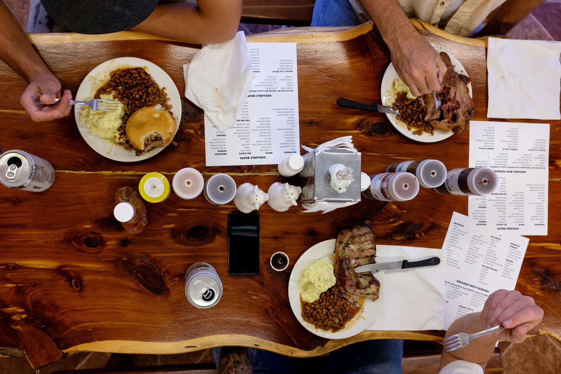Customers at Meats and Eats feast on meals cooked by Kathy and processed by Scott. Image ©Connor Stefanison