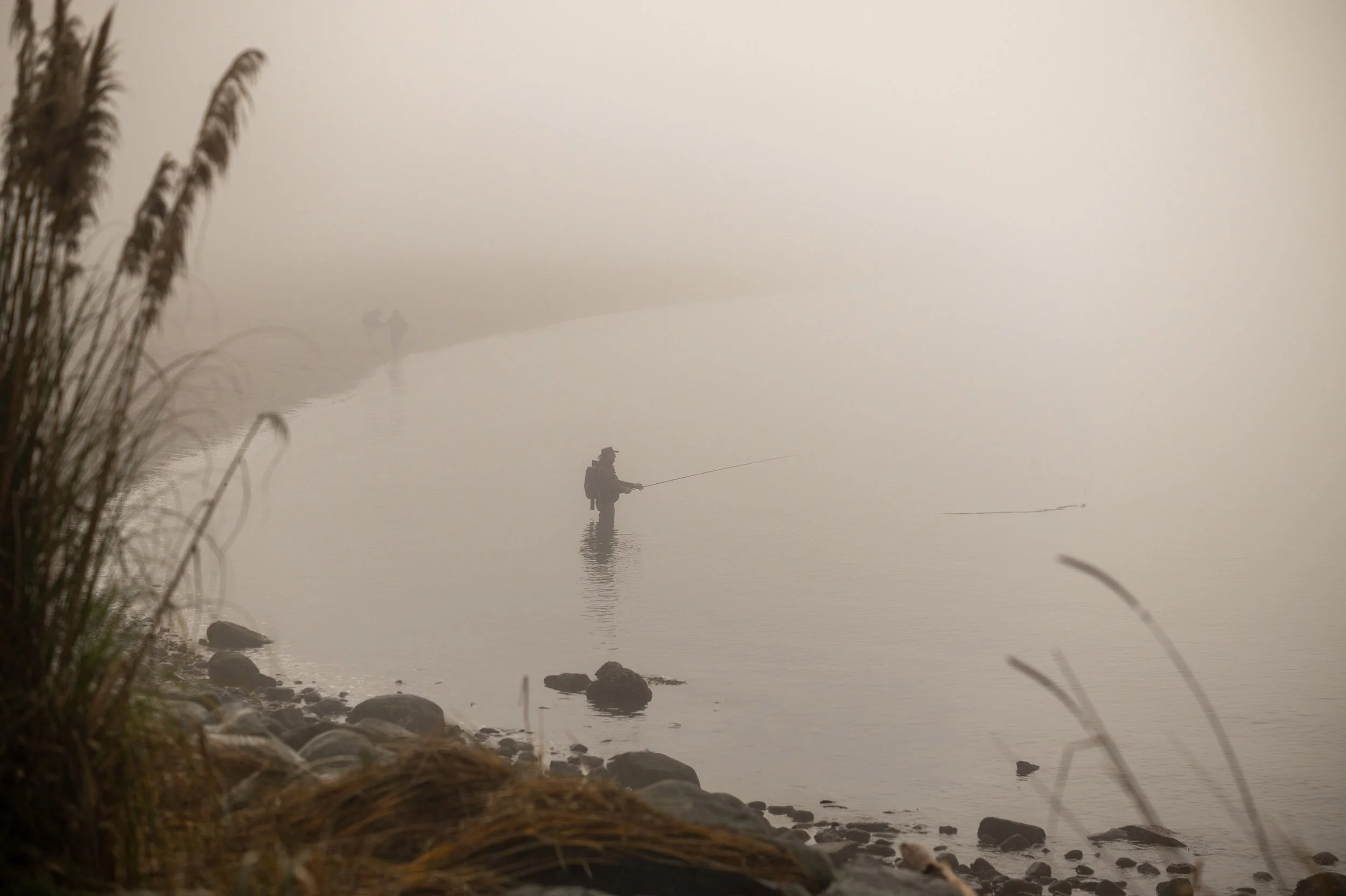 A man is fishing at English Beach in Vancouver. Sample image from a Viltrox 56mm f/1.2 Z (Nikon Z-Mount) and Nikon Z8.